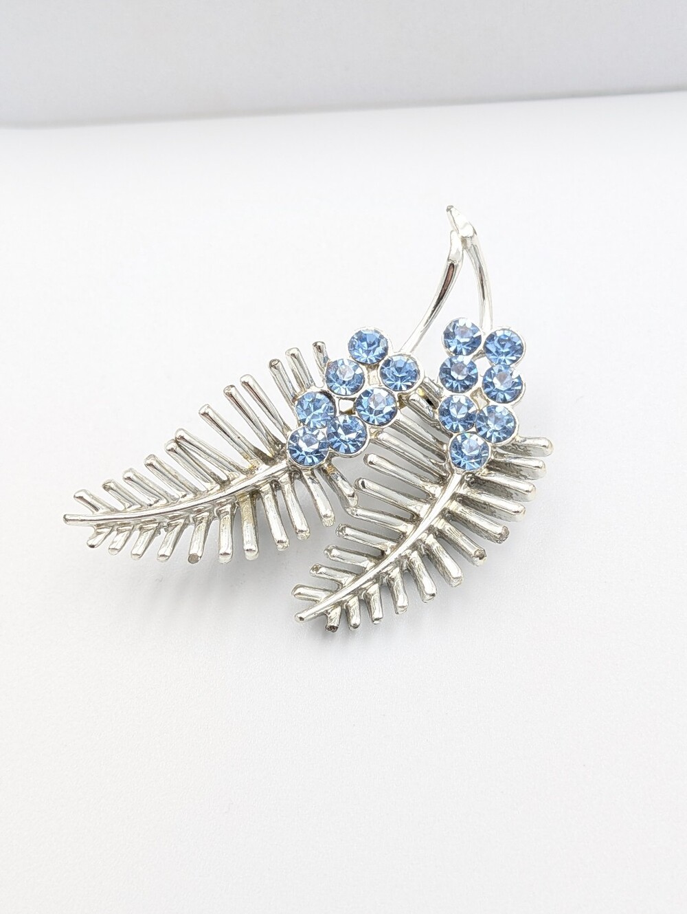 Vintage signed Coro ice blue rhinestone silver tone brooch pin